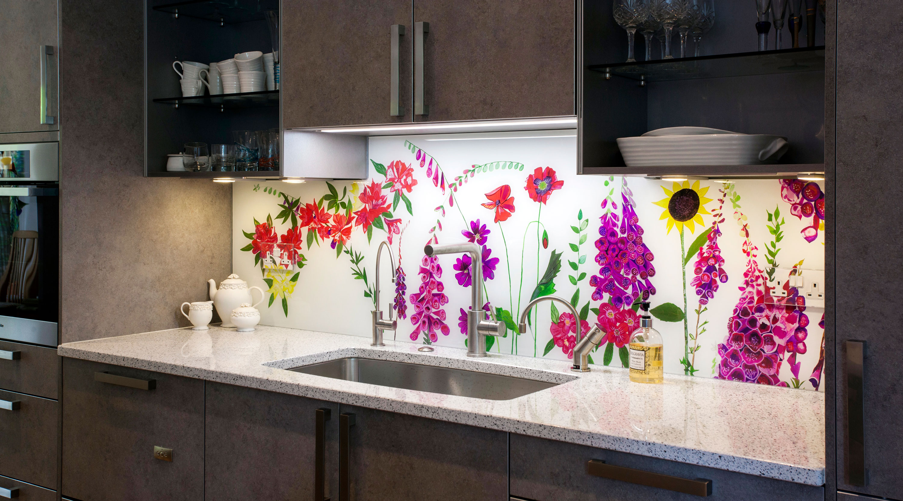 Bespoke floral glass splashback Hampstead Heath featuring sunflowers, foxgloves and rhododendrons, North London.