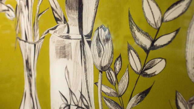Close up glass splashback with tulips in green and black and white