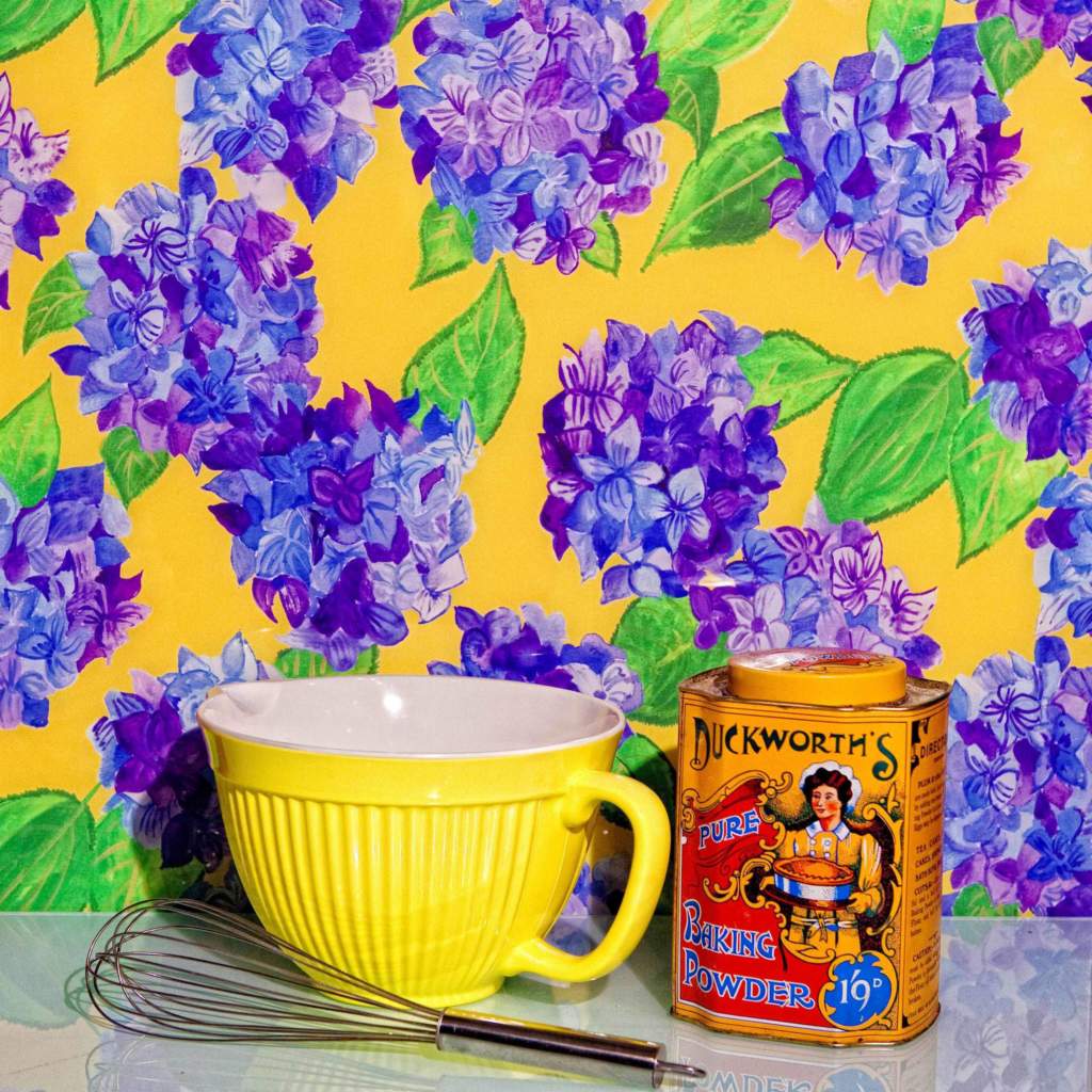 Yellow and Blue hydrangea glass splashback with baking bowl in kitchen