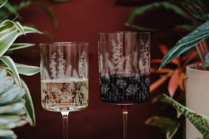 Etched exotic floral pattern red and white wine glasses