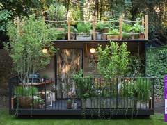 Tales from the Riverbank Garden at RHS Chelsea Flower Show showing Emma Britton glassware in the foreground